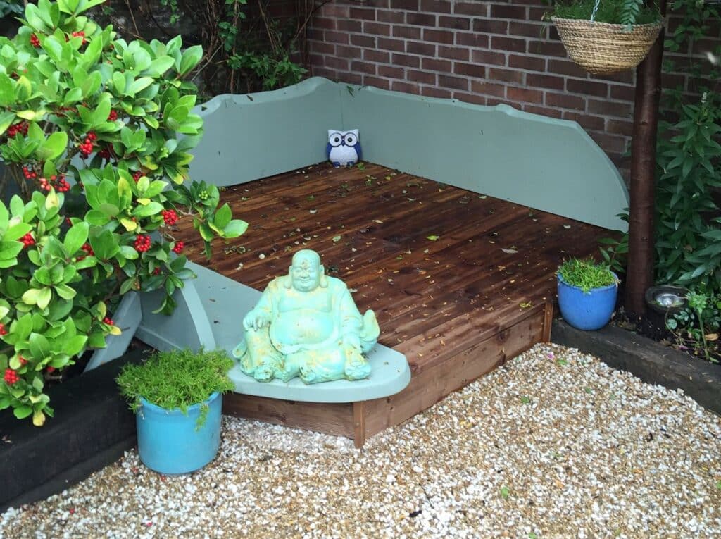 Glastonbury Retreat Courtyard Garden seated buddha